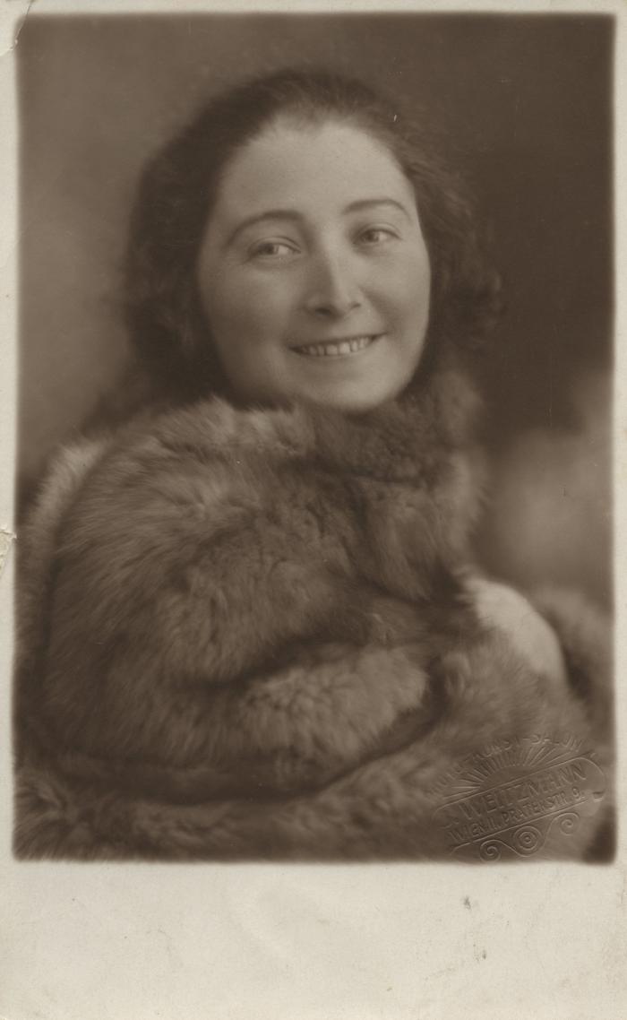 [Photograph of unidentified young girl wearing fur]