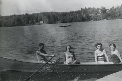 [Photograph of Jennie and three unidentified people in rowboat]